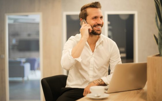 man using smartphone on chair